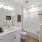 a bathroom with a tub sink and toilet