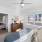 a bedroom with a bed and a fan