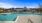 a swimming pool with houses in the background