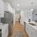 a kitchen with white cabinets