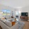 a living room with a tv and couches