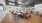 a large living room with a wood floor and a wood floor